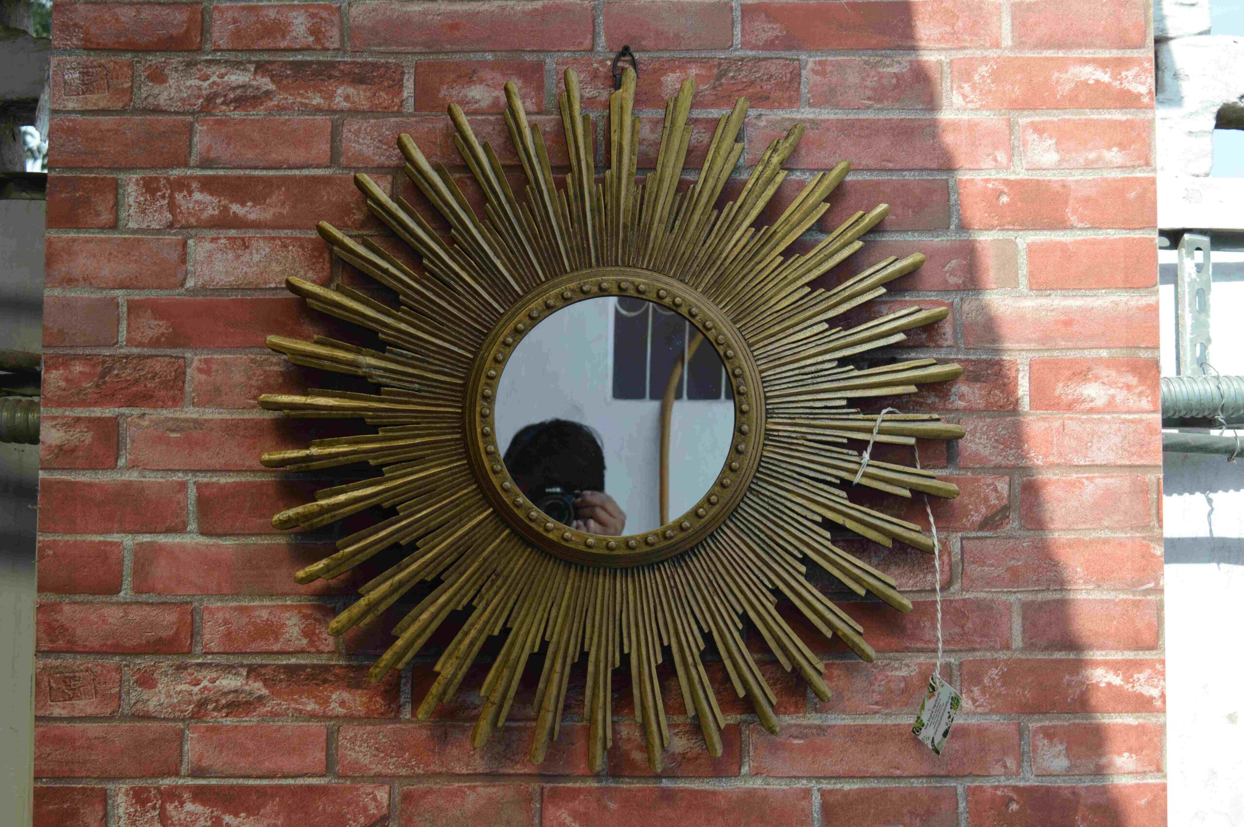 Handcrafted Sunburst Wall Mirror With Golden Decorative Accent